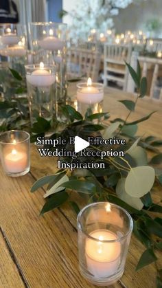 the table is set with candles and greenery