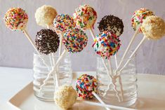 cake pops with sprinkles in glass vases