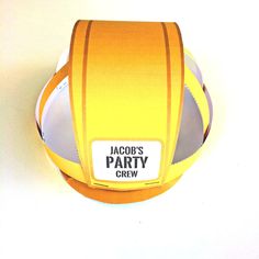 a yellow and white paper party hat with the words jalob's party crew on it