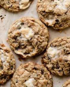 chocolate chip cookies with white crumbles on top