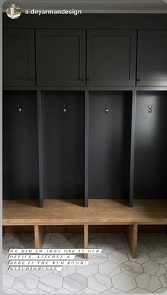 a row of black lockers sitting next to each other on top of a tiled floor