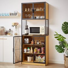 a kitchen area with a microwave and shelves filled with spices, condiments and other items