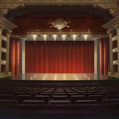 an empty theater stage with red curtains