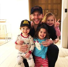 a man and two children posing for a photo