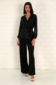 "The black sequined wrap blouse has a modern and stylish look. Our glamorous blouse with its sparkle is an extremely stylish and elegant choice for formal evenings such as cocktails, weddings and all-night/day invitations. The blouse, which is a coupon piece that you should have in your closet, can be combined with sequined twin trousers, baggy and tight classic trousers or jeans. It easily adapts to your body with the shawl model. It is tied around the waist with a belt. S/36 Length from underarm: 43cm/16.9\" Length from Shoulder: 66cm/25.9\" M/38 Length from underarm: 44cm/17.3\" Length from Shoulder: 67cm/26.4\" L/40 Length from underarm: 45cm/17.7\" Length from Shoulder: 68cm/26.8\" XL/42 Length from underarm: 46cm/18.1\" Length from Shoulder: 69cm/27.2\" 2XL/44 Length from armpit: 47c Fitted V-neck Sequin Fabric For Evening, Glamorous Formal V-neck Blouse, Elegant V-neck Holiday Tops, Glamorous V-neck Cocktail Tops, Elegant V-neck Tops For Festive Occasions, Gala Formal Contrast Sequin Fabric, Fitted Sequined V-neck Blouse, Fitted V-neck Sequin Blouse, Glamorous Sequin Fabric For Formal Gala