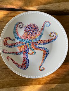 a white plate with an octopus on it