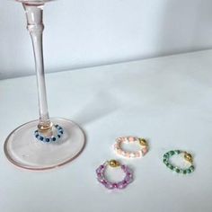 Part of the first collection of Annika V Home! These dainty wine charms are like jewelry for your drinks. And they help you remember which glass is yours!  Made with seed beads, pearls, and magnetic closures for easy use. Comes in set of 4 Drink Charms Diy, Beaded Wine Glass Charms, Diy Wine Charms, 29th Birthday Decorations, Wine Glass Charm, Beads Craft Jewelry, 29th Birthday, Beads Craft, Glass Charms