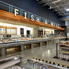 the inside of a restaurant with food on display