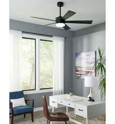 a living room with a white table and blue chair in front of a large window