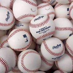 a pile of baseballs sitting next to each other