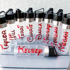 a group of water bottles sitting on top of a table