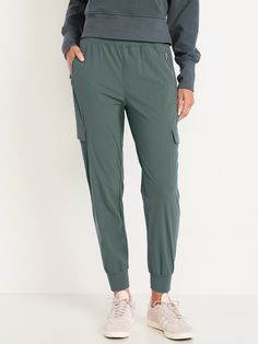 elastic waistband zippered hip pockets flap-cargo pockets at thigh go-dry wicks moisture breathable sits at belly button relaxed thigh 27" regular inseam 25" petite inseam 30" tall inseam models are approx.  5'9" and wear sizes s (4), l (12), and xl (18)machine wash according to the care instruction label  . Best Holiday gift for Women , perfect Joggers for Christmas! Cargo Joggers, Family Maternity, Family Pajamas, Old Navy Women, Big And Tall, Petite Size, Wicks, Belly Button, Old Navy