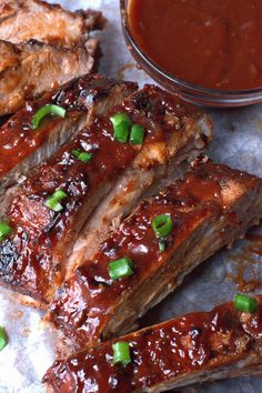 barbecue ribs with sauce and green onions on the side, ready to be served or eaten