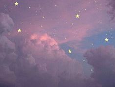 the sky is filled with stars and clouds as well as some pinkish purple hues