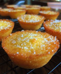 several lemon muffins cooling on a rack