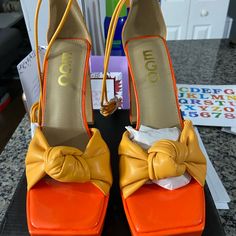 Orange And Yellow Fun Strappy Heel Brand New Never Worn. Fits Larger Than An 8 Yellow Platform Heels For Party, Yellow Heels With Padded Block Heel, Yellow Block Heels With Padded Heel, Trendy Yellow Heels With Heel Strap, Yellow Pointed Toe Sandals With Padded Heel, Yellow Sandals With Padded Heel And Pointed Toe, Yellow High Heel Shoes With Heel Strap, Yellow High Heel With Heel Strap, Yellow Platform High Heels