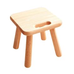 a small wooden stool with a hole in the middle