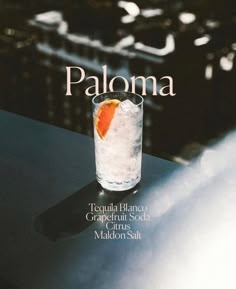 the cover of paloma magazine features an orange slice in a glass with ice and water