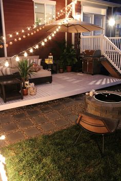 an outdoor patio with lights strung over it