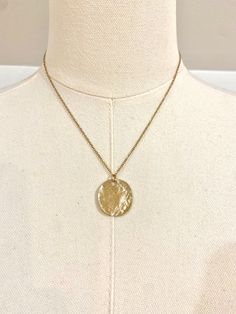 This beautiful 18k gold plated necklace can be worn as a statement piece or layered with other necklaces. Featuring a gold disc pendant, making for a perfect simplistic gold boho/beach style necklace.  ~Material~ High quality 18k gold plated stainless steel chain. ~Length~ 16 inches can be adjusted to 18 inches. M O R E * I N F O R M A T I O N ~Care instruction~ Please remove it before bathing or swimming. Avoid your jewelry touching chemicals such as hairsprays or perfumes. ~Shipping~ After rec Gold-tone Gold Plated Charm Necklace With Round Pendant, Gold-tone Round Pendant Charm Necklace, Gold-plated Locket Necklace With Adjustable Chain, Gold-tone Chain Necklace As A Gift, Gold-tone Round Chain Necklace For Gift, Gold-tone Round Pendant Charm Necklace, Tarnish Resistant, Gold Pendant Locket Necklace With Delicate Chain, Tarnish Resistant Brass Necklace With Round Pendant, Gold-tone Necklace With Large Pendant