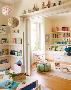 a child's room with bookshelves and toys on the shelves in it