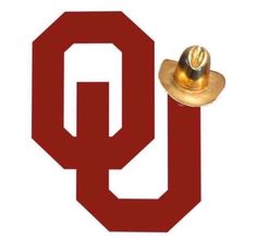 a red and gold hat with the letter q in it's center on a white background