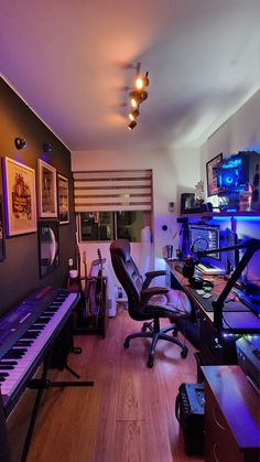 a living room filled with lots of furniture and musical equipment on top of hard wood flooring