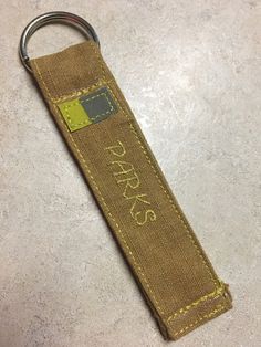 a keychain with the words parks on it