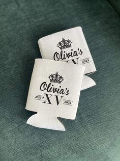 two white labels on the back of a green couch that says, alvia's xiv