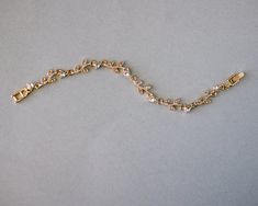 A dainty and delicate bridal bracelet of crystal dotted linked vines. These petite bracelets make a great bridesmaid gift! Gold or silver plated, it measures 7 inches long. Matching necklace set here. Elegant Gold Crystal Bracelet For Bridesmaids, Elegant Gold Crystal Bracelet As Bridesmaid Gift, Dainty Crystal Bracelet With Adjustable Chain For Wedding, Delicate Gold Crystal Bracelet For Wedding, Petite Bracelets, Vine Wedding, Detailed Jewelry, Jewelry Bracelets Silver, Dope Jewelry