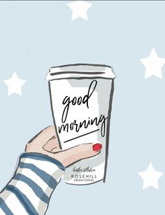 a hand holding a cup with the words good morning written on it and stars in the background