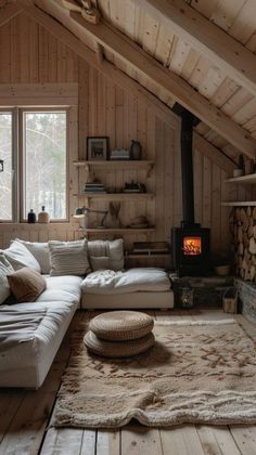 a living room filled with furniture and a fire place in the middle of a room