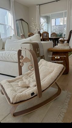 a living room filled with furniture and a rocking chair