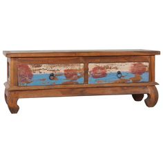 an old wooden chest with two drawers painted in blue and red paint on the front