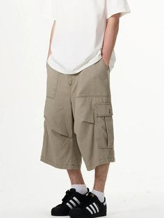 Embrace practicality with a touch of streetwise style in our Cargo Pocket Knee-Length Capri Shorts, designed for the modern man. Crafted with utmost attention to detail, these knee-length shorts feature a robust fabric blend that's pre-washed for a lived-in feel. The multiple cargo pockets not only enhance the utilitarian appeal but also add a layer of functionality, perfect for keeping your essentials at hand. The straight, loose fit ensures ease of movement and comfort throughout your day. Whe Khaki Shorts Outfit, Long Cargo Shorts, Cargo Shorts Outfit, Baggy Cargo Shorts, Oversized Shorts, Mens Cargo Shorts, Mens Shorts Outfits, Shorts Y2k, Capri Shorts