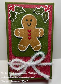 a handmade christmas card with a ginger on it's front and bottom corner