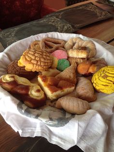 a white plate topped with lots of different types of pastries