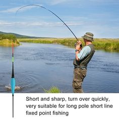 a man standing next to a river while holding a fishing pole and hook on it