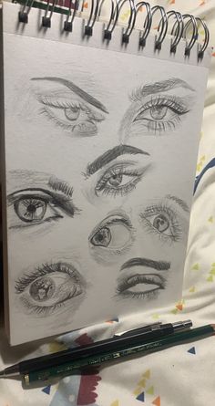 a drawing of different eyes on a sheet of paper