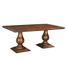 a wooden table with two pedestals on each side