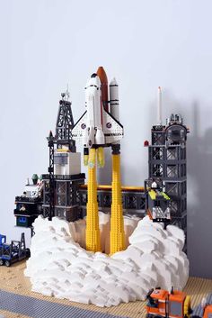 a lego model of a space shuttle on display