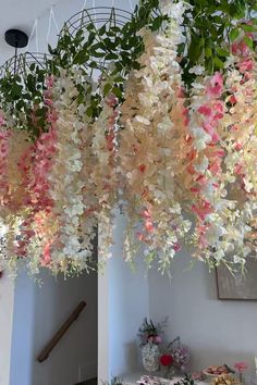 flowers hanging from the ceiling in a room