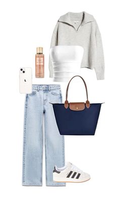 a woman in white shirt and jeans with handbag