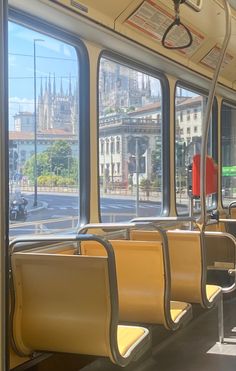 the inside of a bus with lots of seats and windows on it's sides