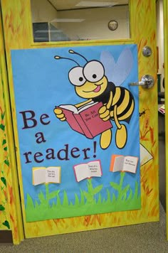 a classroom door decorated with a bee reading a book