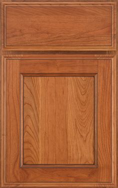 a wooden cabinet door with square and rectangle design