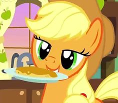 the pony is holding a plate with food on it