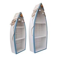 two white and blue boats shaped shelves with rope on each one's sides, set against a white background