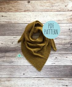 an image of a scarf on a wooden background with the words pdd pattern above it