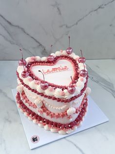 a heart shaped cake on top of a table